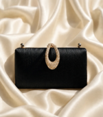 Black embellished clutch bag with crystal handle for bridal party wear in Pakistan