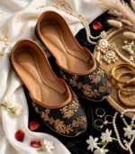 Black Khussa for Women flatlay with gold jewelry