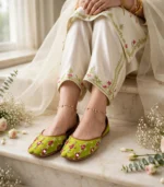 Lime green bridal khussa styled with pearl anklets and ivory couture pants