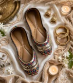 Luxury bridal khussa shoes flatlay with pearls, bangles and jhumka earrings