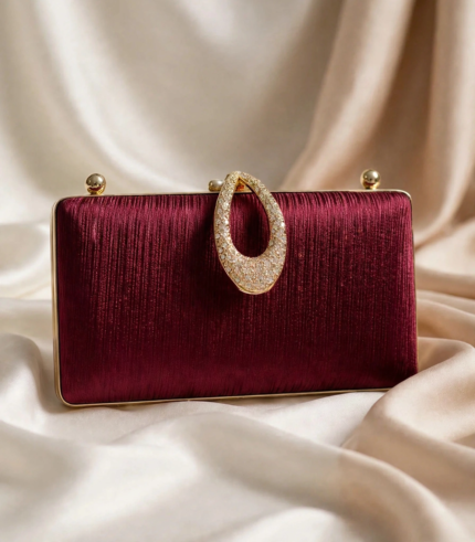 Maroon embellished clutch bag with crystal oval handle for bridal party wear