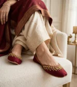 Woman wearing maroon velvet khussa Pakistan with bridal dress