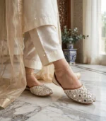 Mirror work bridal khussa styled with ivory silk pants and gold anklet