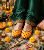 Mustard bridal jutti styled with mehndi flowers and diyas