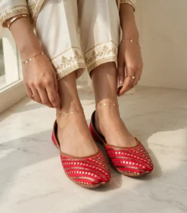 Bridal khussa for women styled with gold anklets and rings