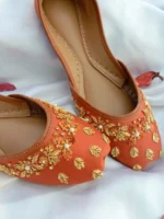 Rust bridal khussa with pearl and gold embroidery