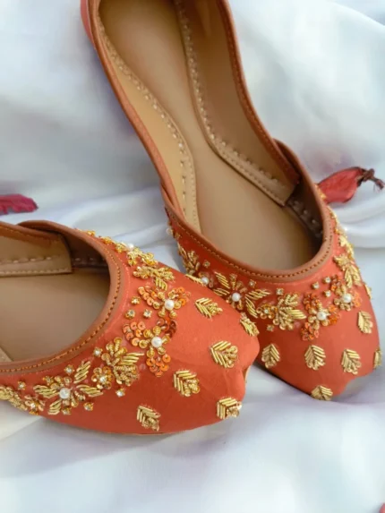 Rust bridal khussa with pearl and gold embroidery