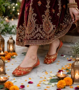 Rust bridal khussa paired with maroon lehenga