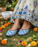 Women flat khussa shoes with blue floral embroidery worn at mehndi