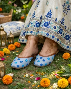 Women flat khussa shoes with blue floral embroidery worn at mehndi