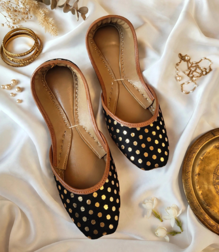 Black polka dot khussa with gold foil print and tan leather trim