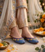 Handmade blue beaded khussa mules styled with a festive beige embroidered suit