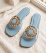 Blue crystal flat sandals for women with transparent strap and gold sunburst embellishment