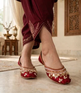 Bridal khussa for women in maroon satin with mirror work, styled with embroidered shalwar