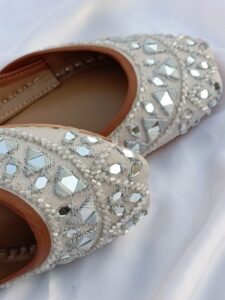 Ivory bridal khussa with mirror work and beadwork, handmade in Pakistan