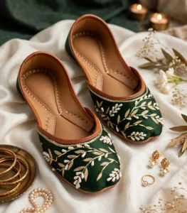 Emerald green bridal khussa flat lay with bangles and jewellery