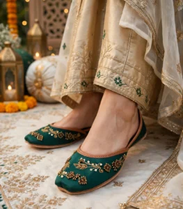 Emerald green bridal khussa worn at a wedding mehndi function with décor