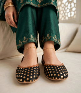 Comfortable black flat khussa with gold anklet and embroidered green trousers