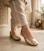 Gold khussa for women styled with beige embroidered trousers