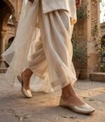 Golden flat khussa for ladies worn with a cream dupatta and dhoti shalwar