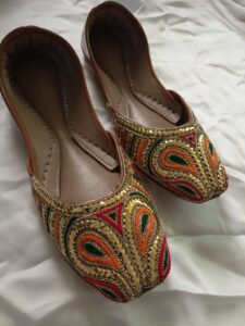 Handmade embroidered khussa shoes for women in Pakistan with gold and paisley design