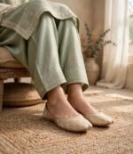 Handmade brocade khussa shoes styled with a sage green embroidered suit