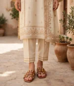 Studded flat slide sandals for women paired with a cream embroidered Pakistani suit