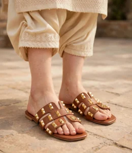 Tan brown studded flat sandals for women styled with a cream embroidered shalwar kameez