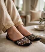 Mirror work khussa shoes worn indoors with golden shalwar