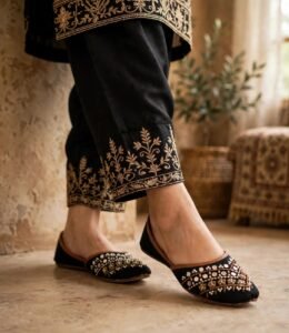 Mirror work khussa shoes captured in outdoor walking shot