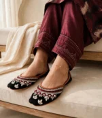 Mirror work khussa women styled with maroon embroidered shalwar kameez