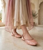 Peach khussa flats women styled at Pakistani heritage venue