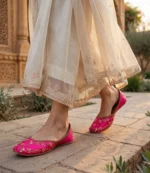Pink bridal khussa for women styled with cream embroidered dress