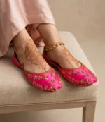 Pink khussa for women worn with mehndi design on feet