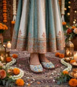 Printed khussa for women styled with a blue and cream embroidered lehenga