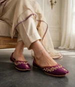 Purple bridal khussa online worn with anklets and cream bridal outfit