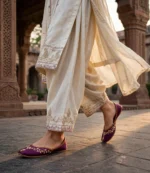 Purple bridal khussa online paired with ivory embroidered kurta