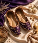 Flat lay of fancy purple khussa with sequin embroidery, tan trim and stitched insole