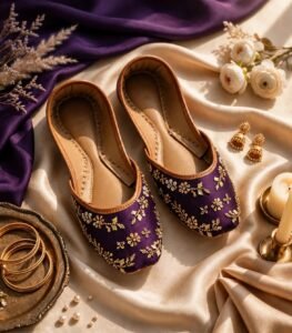 Flat lay of fancy purple khussa with sequin embroidery, tan trim and stitched insole
