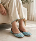 Turquoise embroidered khussa styled with silver anklets