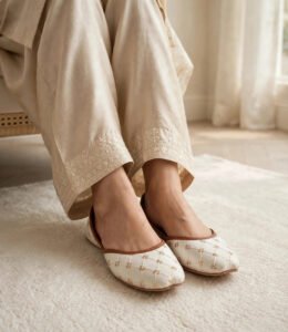 White bridal khussa Pakistan design on cozy indoor rug