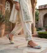 Close-up of ultra thin sole khussa for women showing floral pattern on marble steps