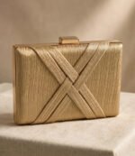 Golden party wear clutch bag with gold push-lock clasp and textured fabric