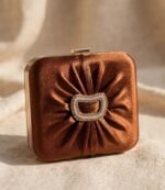 Copper pleated wedding clutch bag Pakistan with stone buckle and gold frame